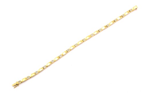 Lot 4 - A 9ct gold and diamond line bracelet,...