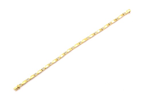 Lot 4 - A 9ct gold and diamond line bracelet,...
