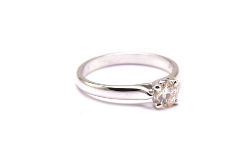 Lot 27 - An 18ct white gold and diamond solitaire ring,...