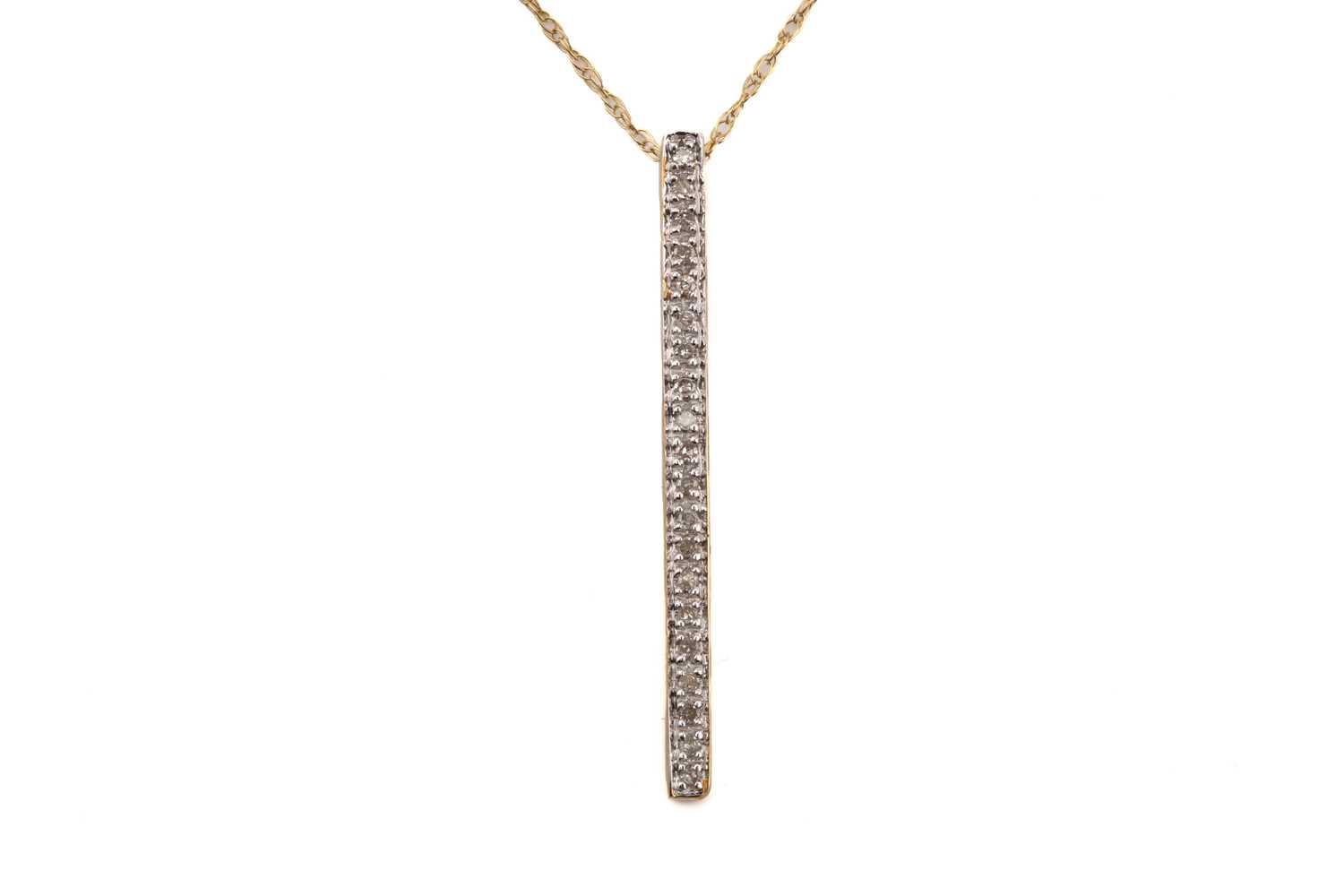 Lot 251 - A diamond bar pendant on chain, comprises a...