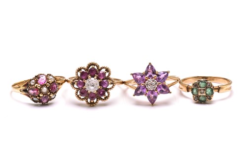 Lot 74 - A mixed collection of four flowerhead rings,...