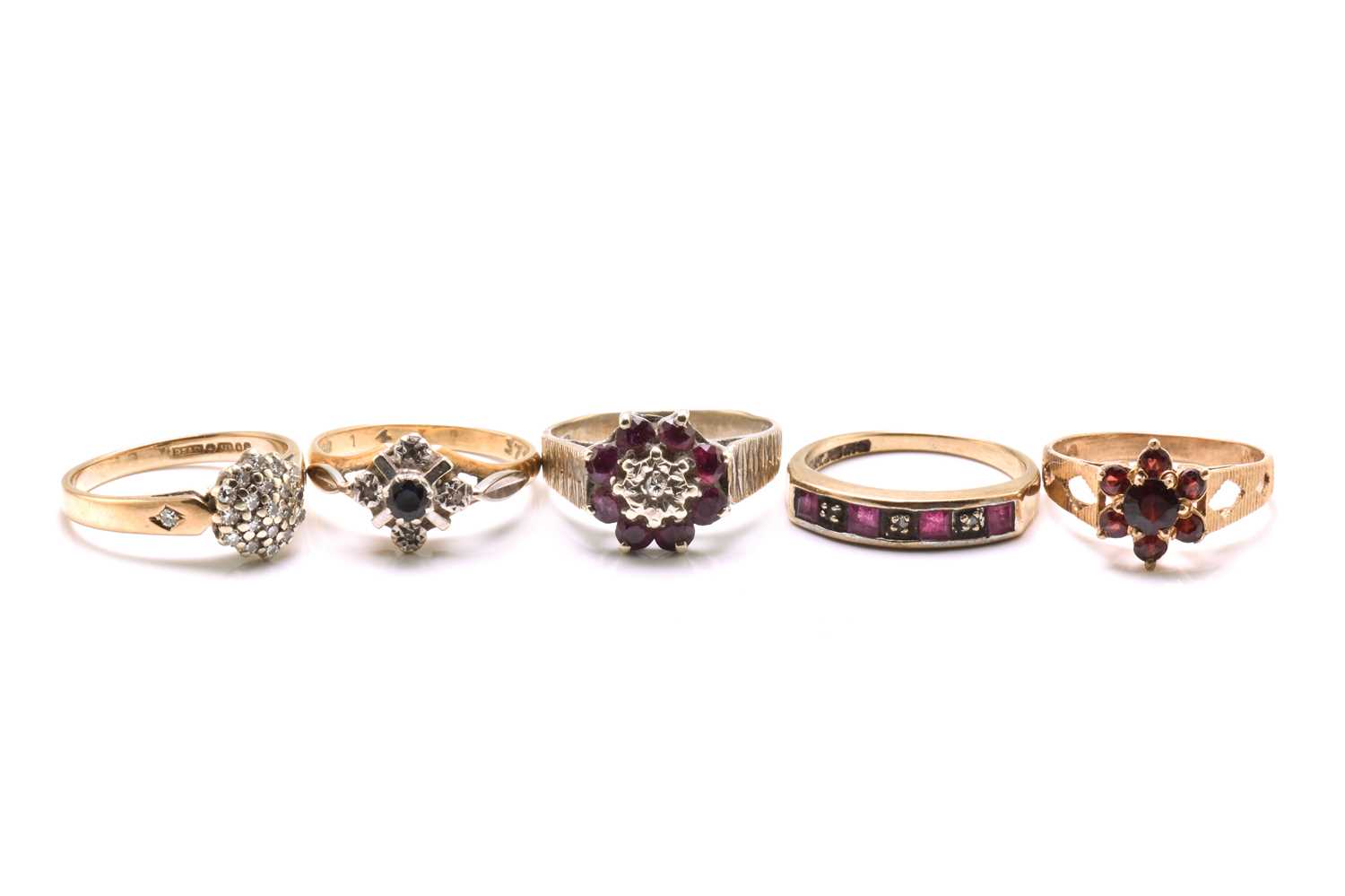 Lot 124 - A lot of five gem-set gold rings, to include a...