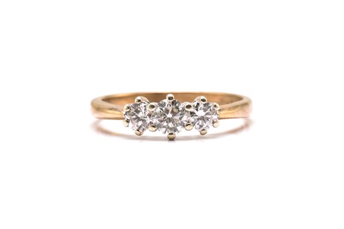 Lot 55 - A 9ct gold and three-stone diamond ring,...