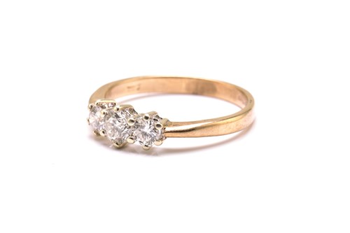 Lot 55 - A 9ct gold and three-stone diamond ring,...