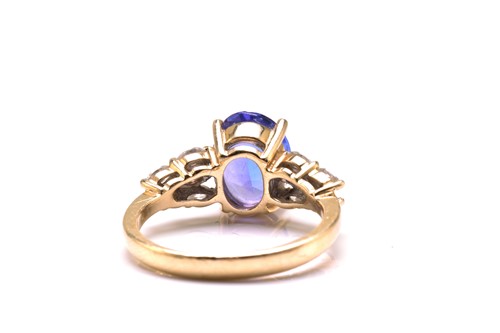 Lot 21 - A tanzanite and diamond dress ring, featuring...