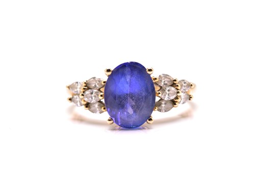 Lot 21 - A tanzanite and diamond dress ring, featuring...