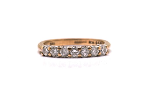 Lot 187 - A 9ct gold seven-stone diamond ring,...