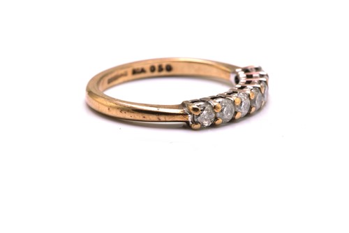 Lot 187 - A 9ct gold seven-stone diamond ring,...
