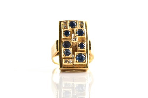 Lot 213 - A modernist sapphire and diamond ring,...