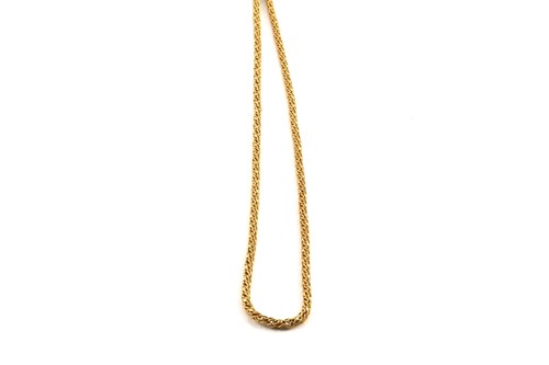 Lot 155 - A lariat necklace in yellow precious metal,...
