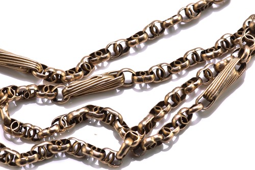 Lot 104 - An early 20th-century muff chain, with fancy...