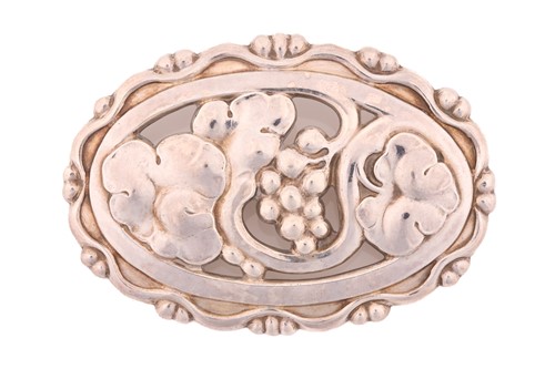 Lot 338 - Georg Jensen - a silver oval brooch, depicting...