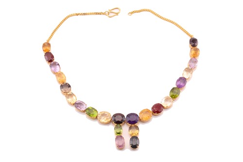 Lot 156 - A multi gem-set rivière necklace in gilt metal,...