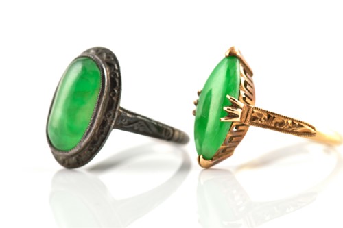 Lot 42 - Two jade rings, one comprises a...