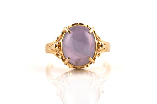 Lot 171 - A star sapphire ring, comprises an oval star...