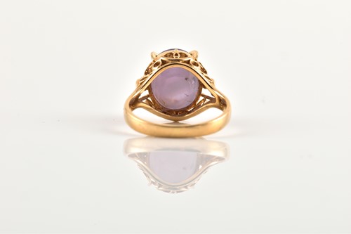 Lot 171 - A star sapphire ring, comprises an oval star...