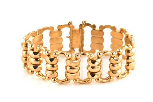 Lot 1 - A fancy link bracelet in yellow precious metal,...