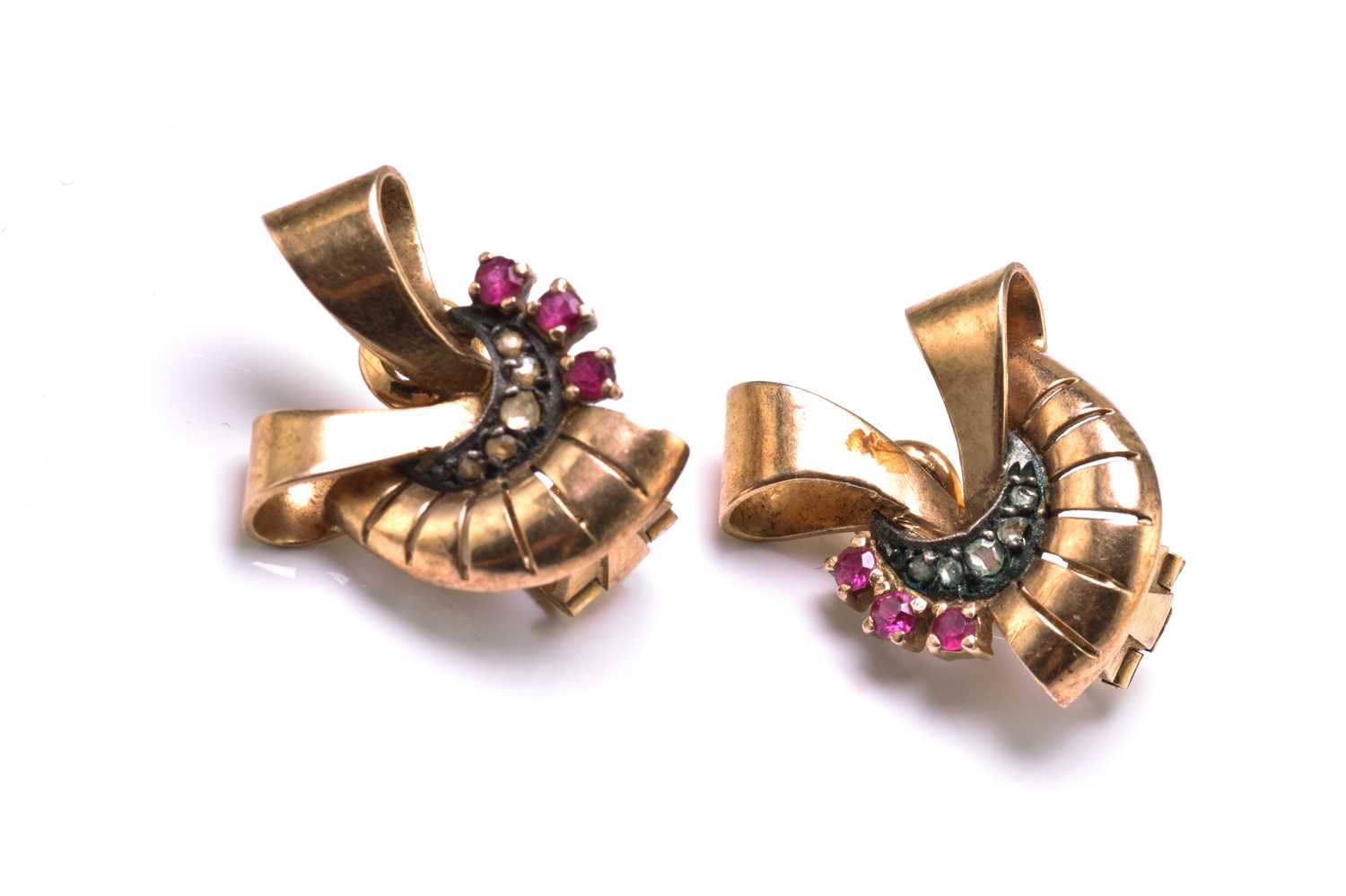 Lot 13 - A pair of ribbon motif earrings, each set with...
