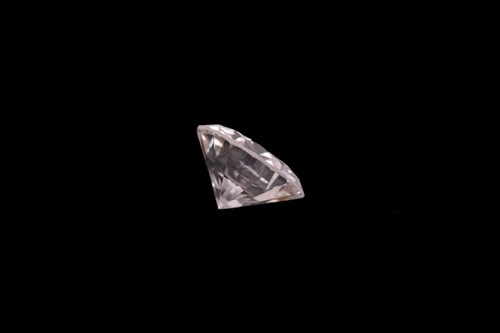 Lot 9 - A loose diamond, the round brilliant-cut white...