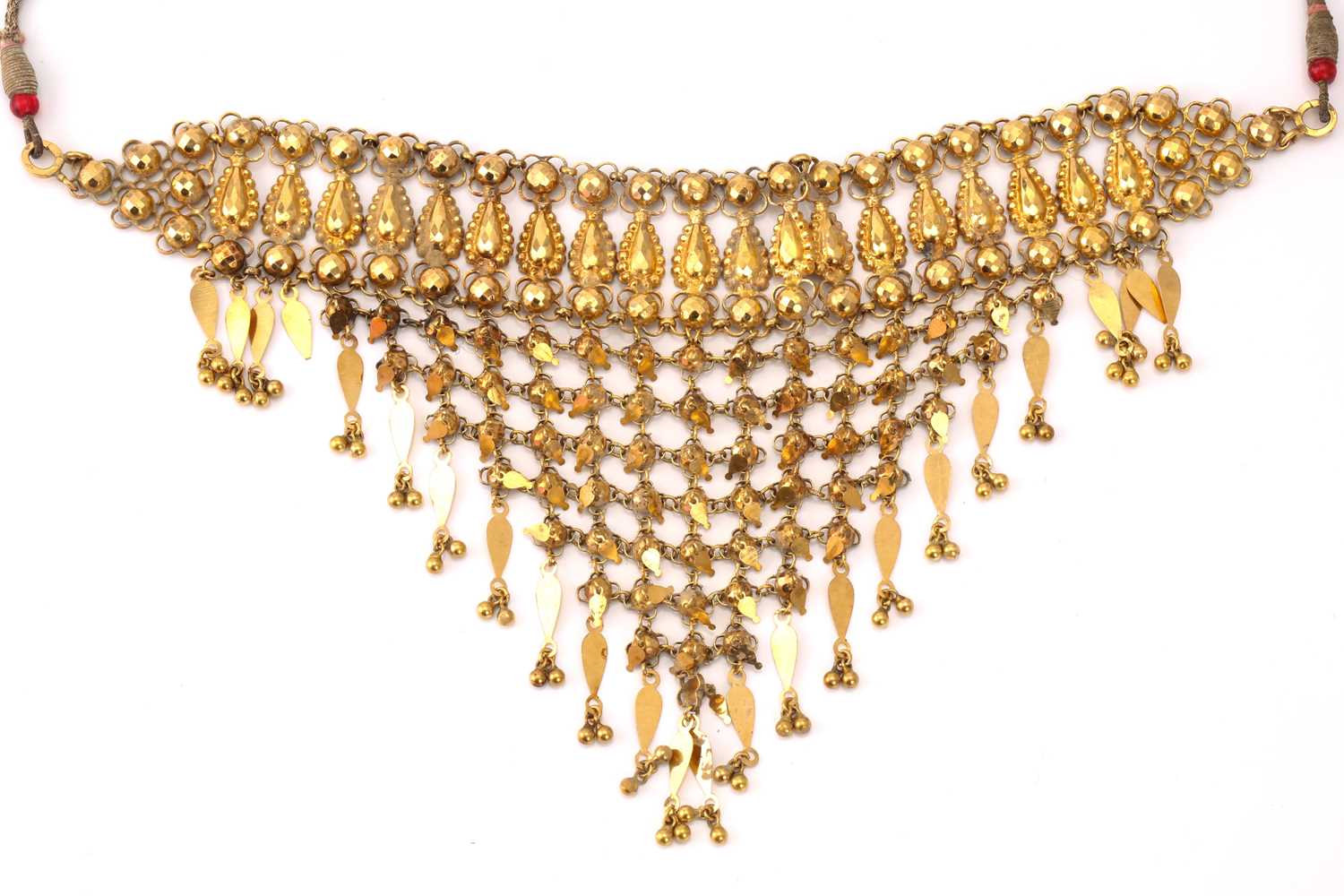 Lot 44 - An Indian tribal bib necklace in yellow...