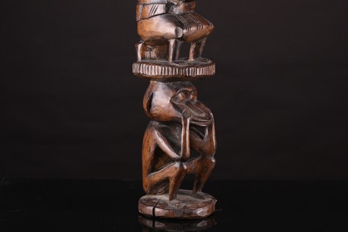 Lot 164 - A Yoruba Shango post, Nigeria, a seated male...