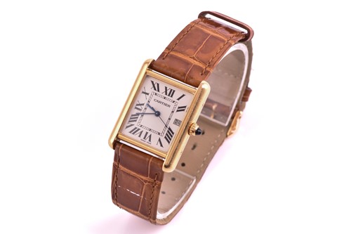 Lot 422 - An 18ct yellow gold Cartier Tank mid-size with...