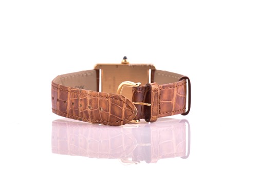Lot 422 - An 18ct yellow gold Cartier Tank mid-size with...