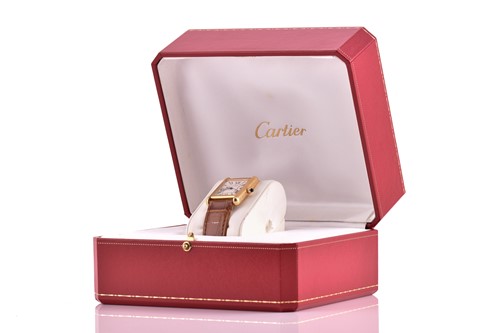 Lot 422 - An 18ct yellow gold Cartier Tank mid-size with...