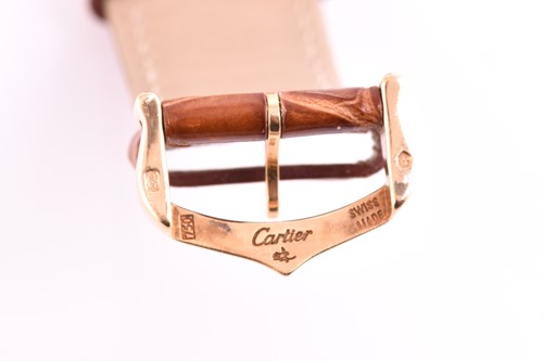 Lot 422 - An 18ct yellow gold Cartier Tank mid-size with...