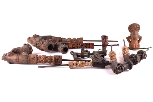 Lot 257 - A collection of Bamum pottery pipes, with...