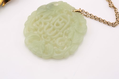 Lot 151 - A lot consists of a Chinese carved pendant on...