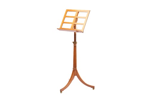 Lot 273 - An Edwardian golden oak adjustable music stand...