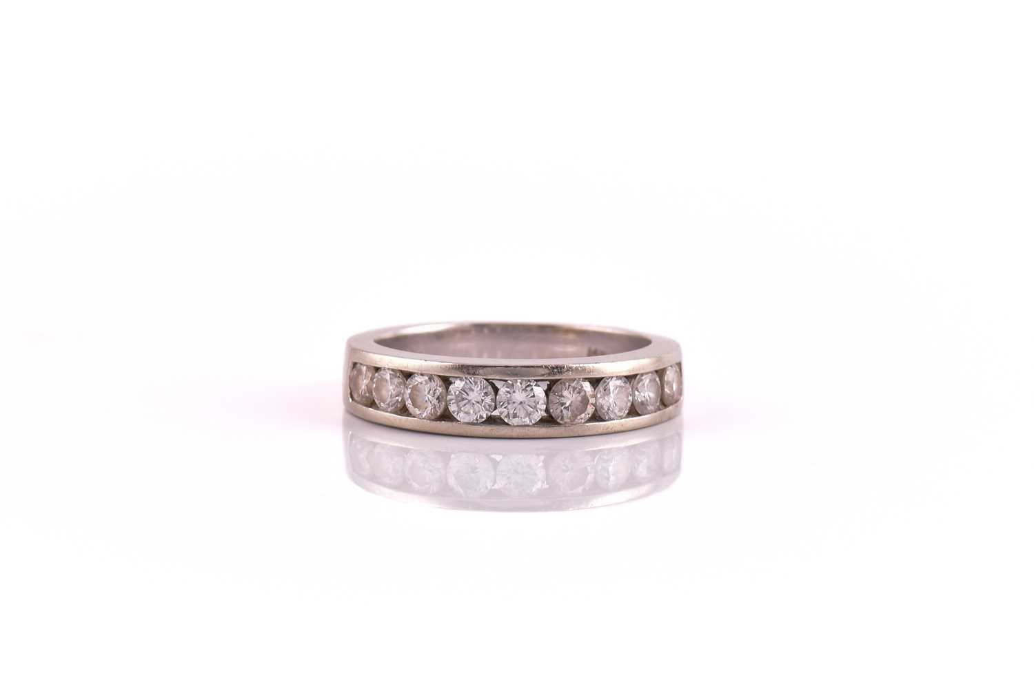 Lot 51 - A diamond half eternity ring, consisting of...