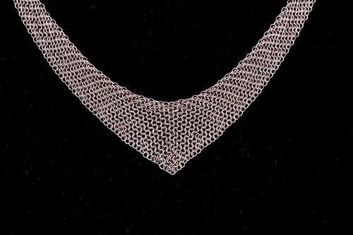 Lot 136 - Tiffany & Co. - A silver mesh bib necklace...