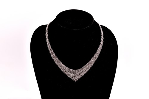 Lot 136 - Tiffany & Co. - A silver mesh bib necklace...