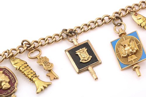 Lot 28 - A gold-filled bracelet with assorted college...