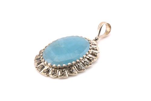 Lot 199 - An aquamarine and diamond pendant, with an...