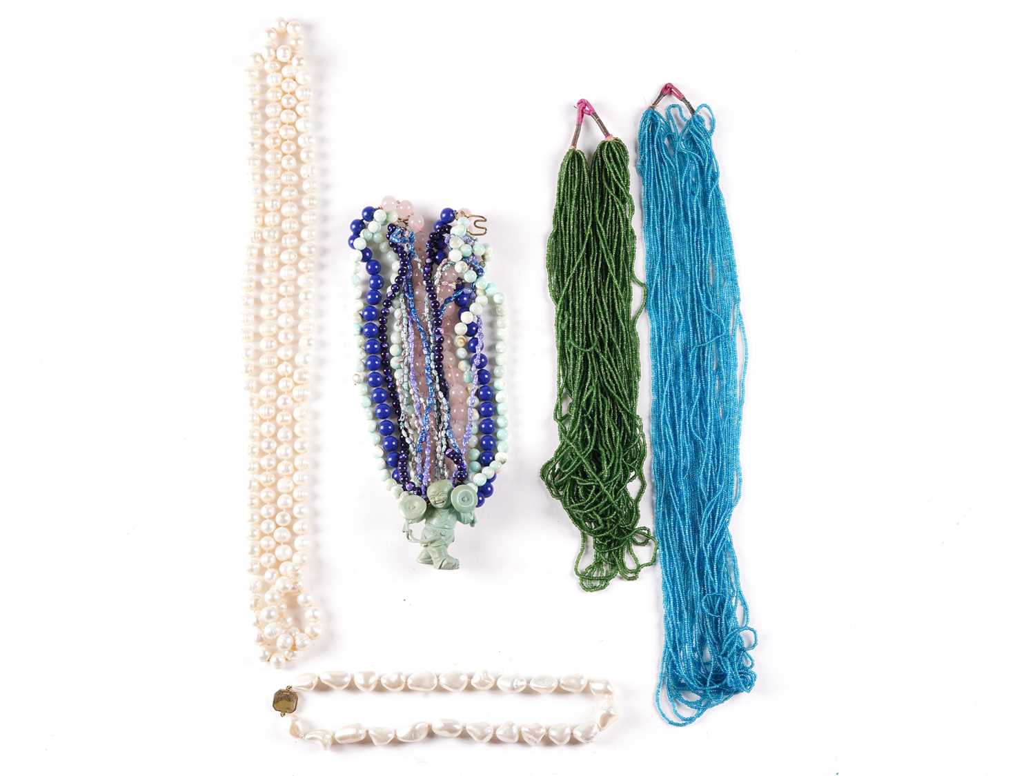 Lot 160 - Five necklaces comprising a multi-strand blue...