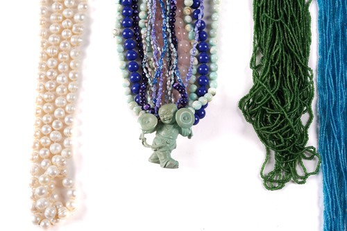 Lot 160 - Five necklaces comprising a multi-strand blue...