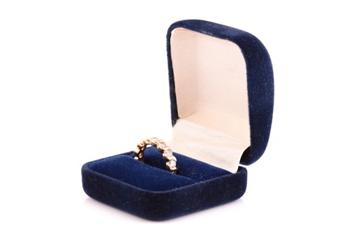 Lot 203 - A diamond eternity ring, comprises fourteen...