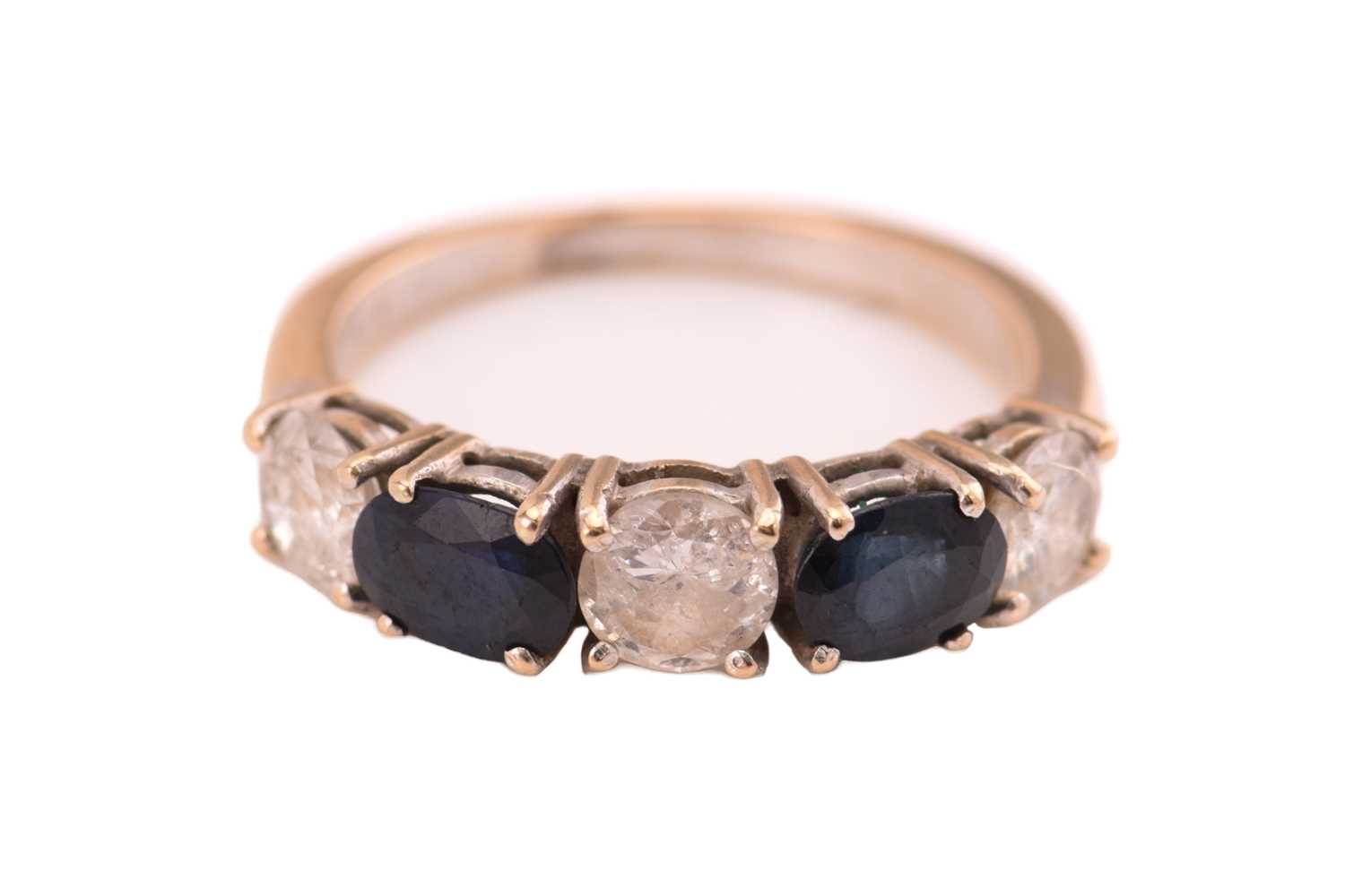 Lot 49 - A sapphire and diamond ring, consisting of two...