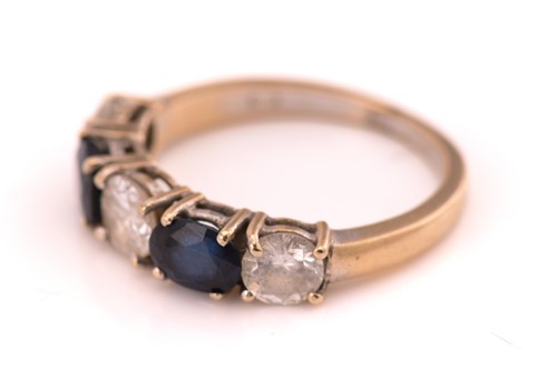 Lot 49 - A sapphire and diamond ring, consisting of two...