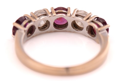 Lot 66 - A ruby and diamond five-stones ring,...