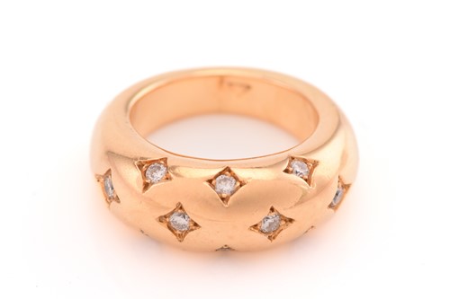 Lot 26 - A bombé ring with diamonds, consisting of ten...