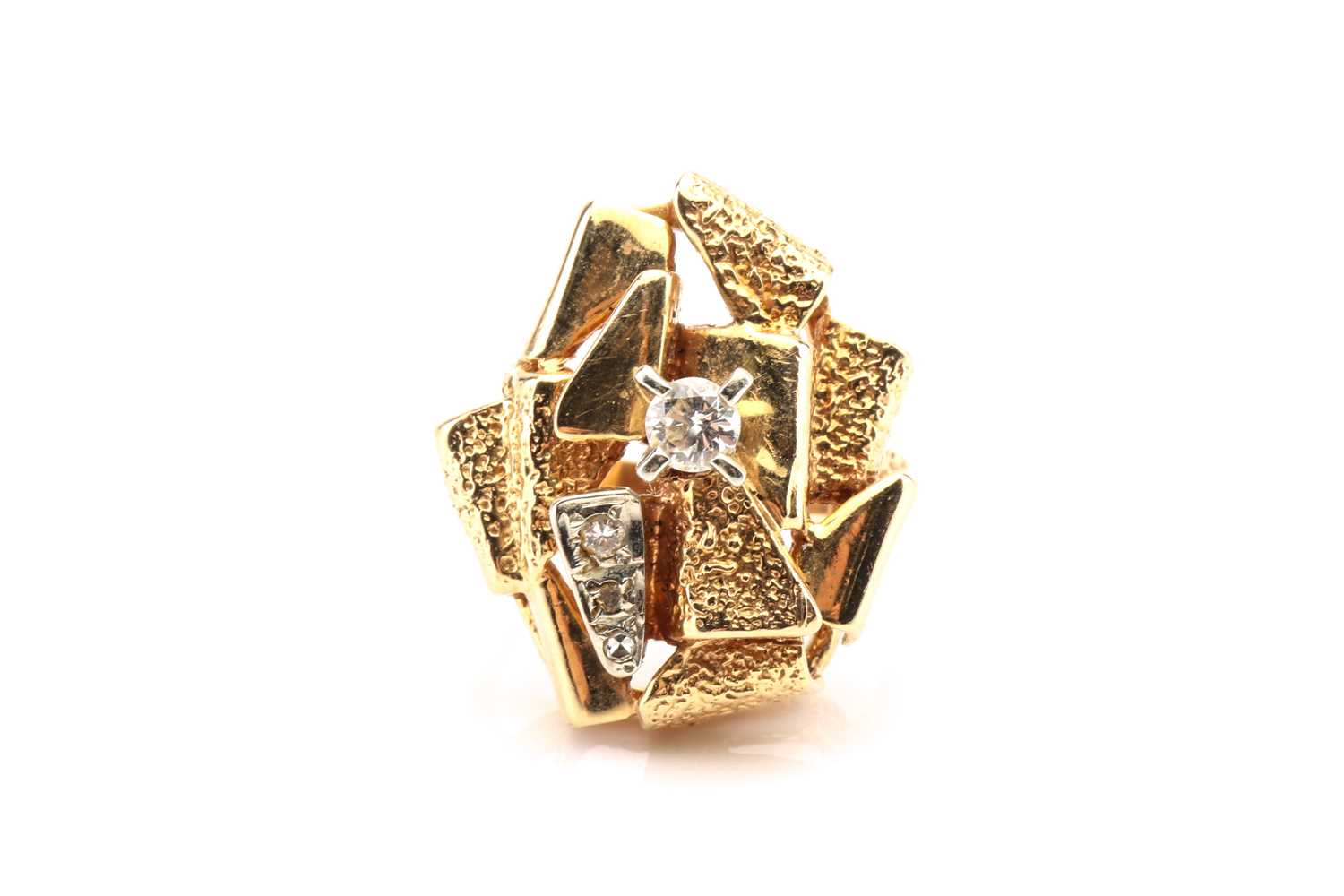 Lot 78 - A modernist yellow metal and diamond ring,...