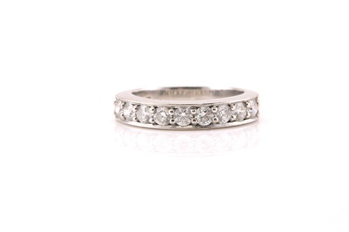 Lot 121 - A diamond half eternity ring in 18ct gold,...