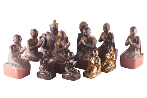 Lot 179 - A set of six carved wood Tibetan praying monks,...