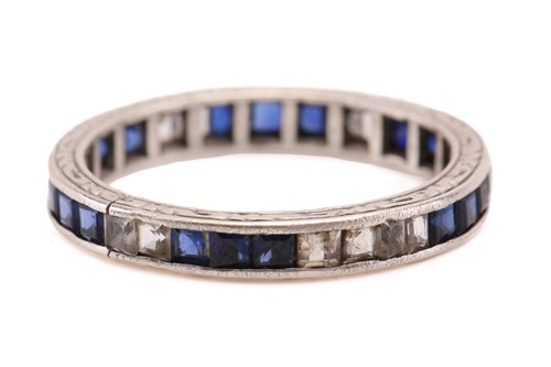 Lot 297 - An eternity ring with sapphires, consisting of...