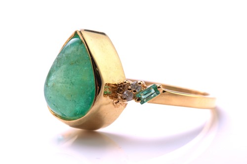 Lot 79 - An emerald and diamond 18ct gold ring, centred...