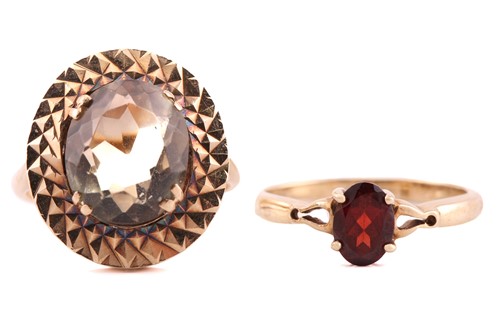 Lot 257 - Two 9ct gold gem-set rings, one has an oval...